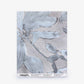 A sample sheet of Plumeria Shadows Silk Wallcovering in the Shadow colorway, featuring a gray watercolor floral pattern, is displayed against a white background.