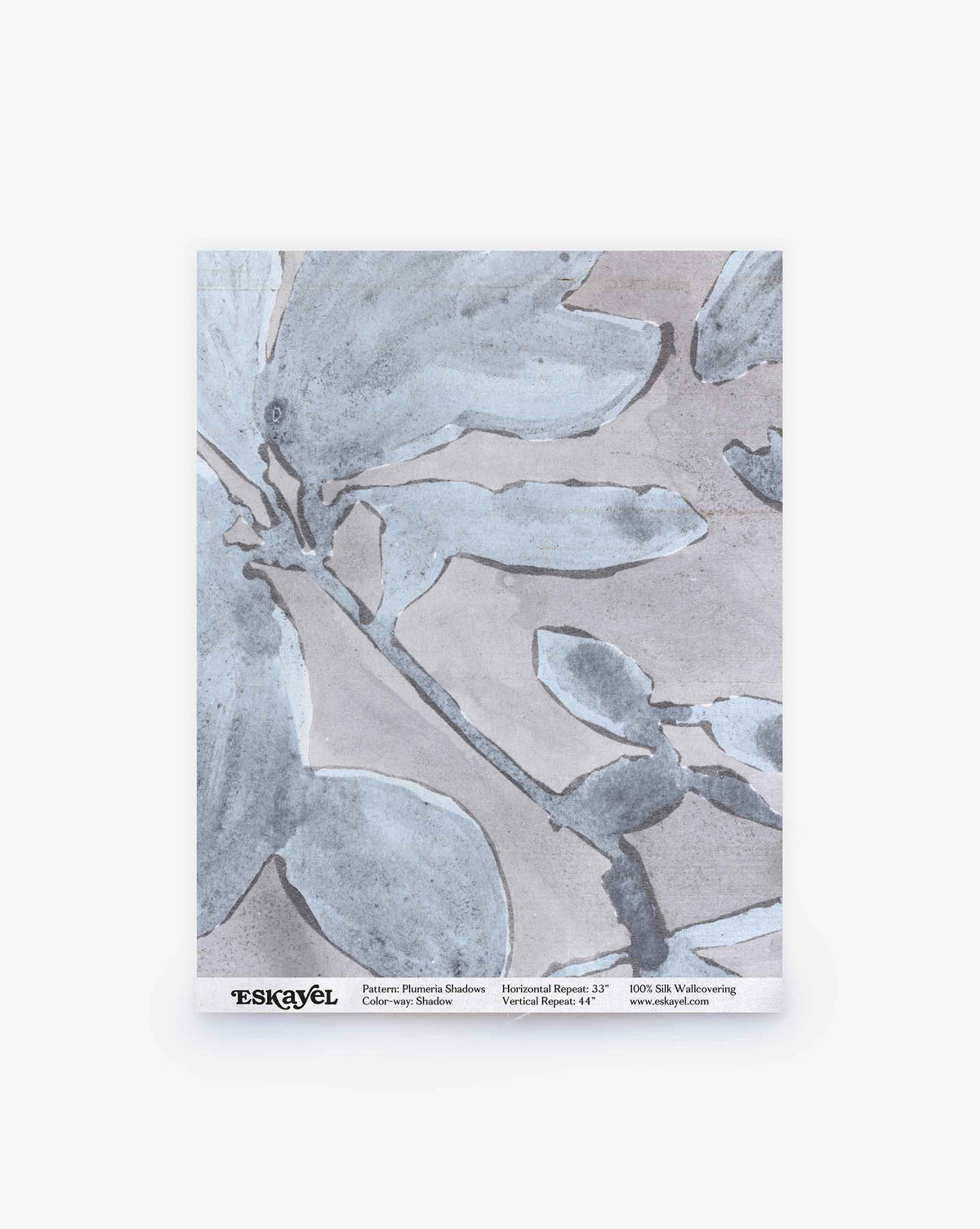 A sample sheet of Plumeria Shadows Silk Wallcovering in the Shadow colorway, featuring a gray watercolor floral pattern, is displayed against a white background.