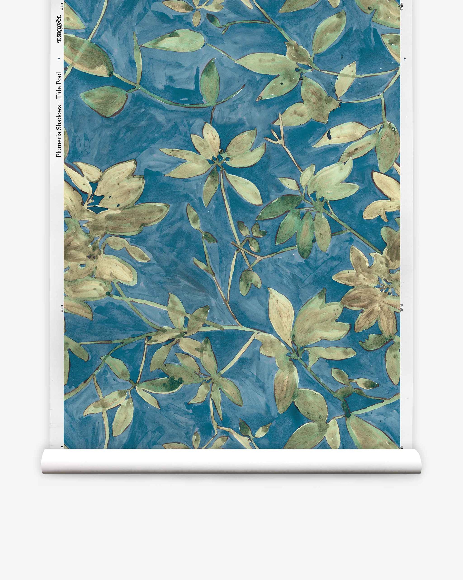Plumeria Shadows Silk Wallcovering in Tide Pool features a blue background adorned with green and beige leaves and branches, bringing an elegant, nature-inspired touch to your space.