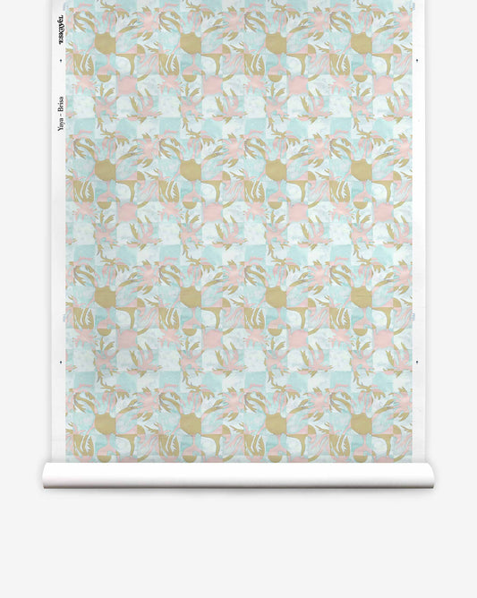 Yaya Silk Wallcovering Brisa roll featuring a repeating pattern of soft blue, pink, and gold abstract shapes over a light checkered coastal background.