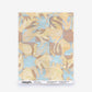 A Yaya Silk Sample in Husk, featuring a patterned print of stylized, overlapping botanical shapes in muted blue, brown, and tan.