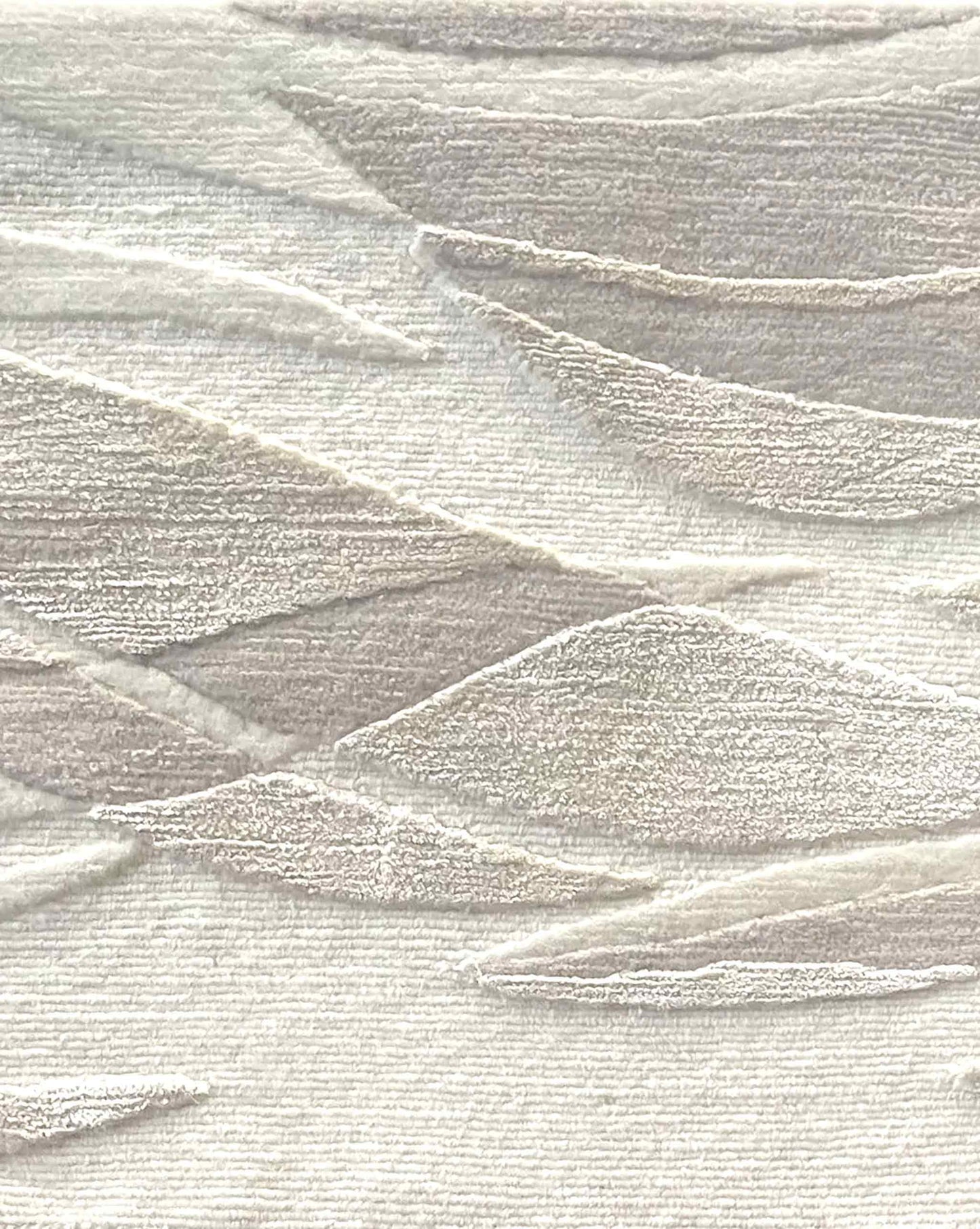 Closeup of Cascade rug in Arctic – A hand-knotted custom rug in an abstract flowing pattern using neutral shades of light grey and white | Eskayel