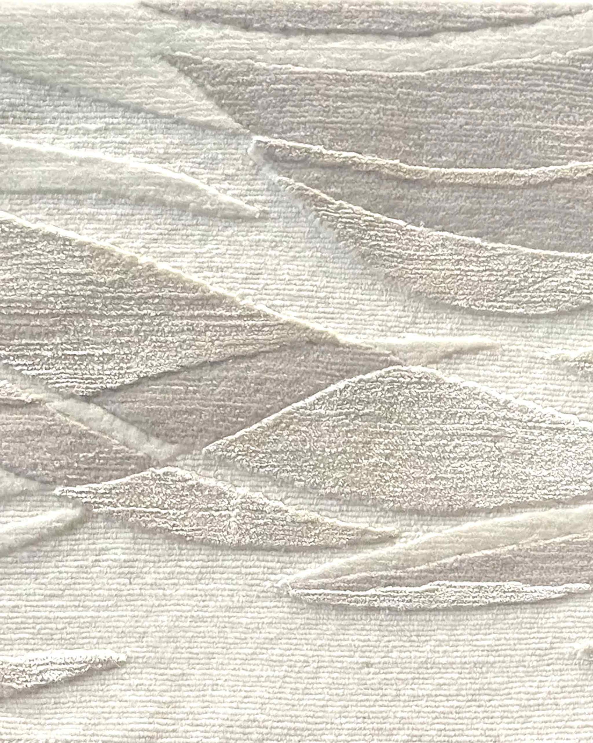 Closeup of Cascade rug in Arctic – A hand-knotted custom rug in an abstract flowing pattern using neutral shades of light grey and white | Eskayel