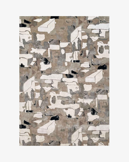 An abstract rectangular rug with a modern geometric pattern in beige, white, gray, and black, shown flat against a light gray background.