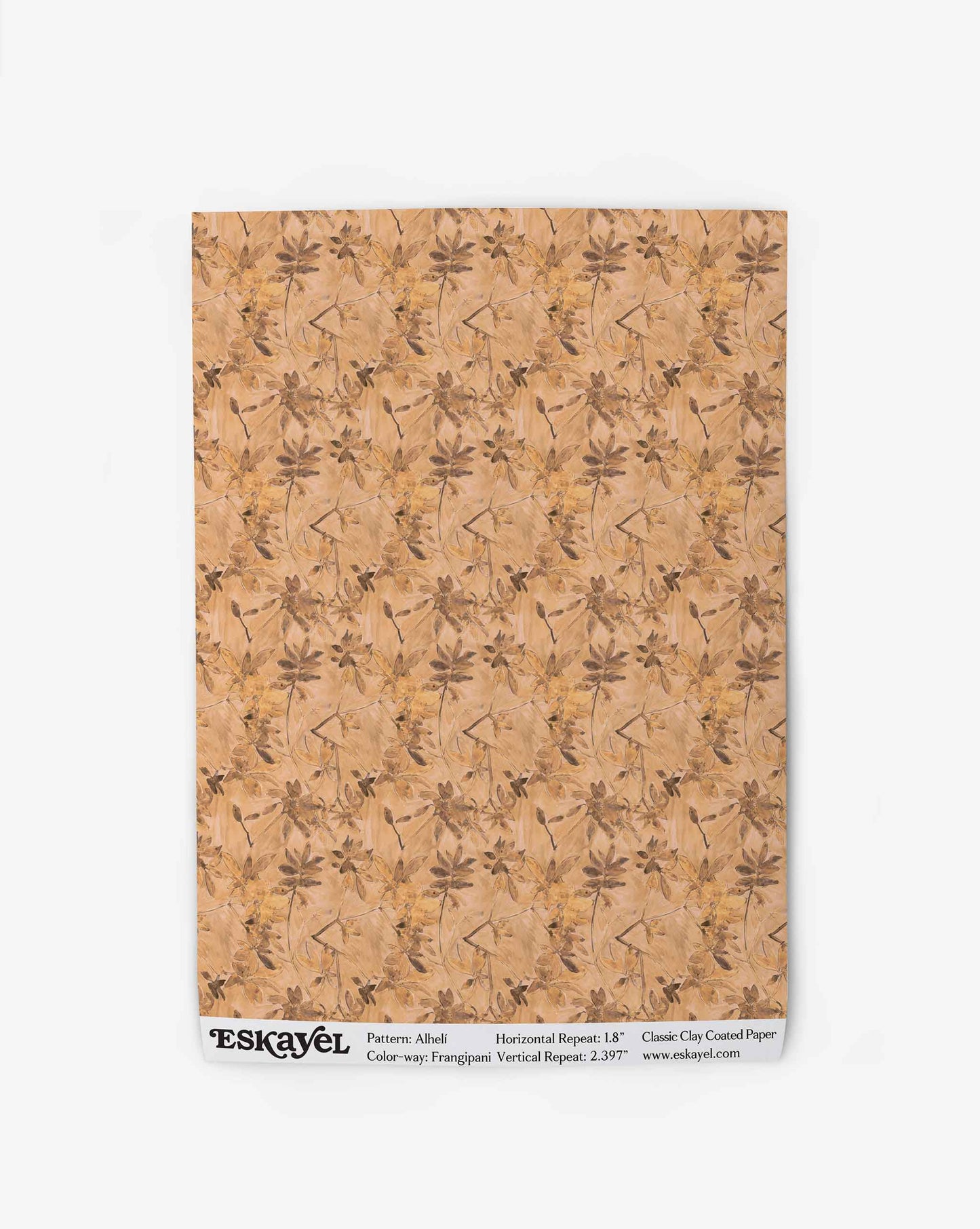 A swatch of Eskayel’s Alhelí wallpaper, a tiny repeating pattern inspired by tropical living, in the beige-based colorway Frangipani.