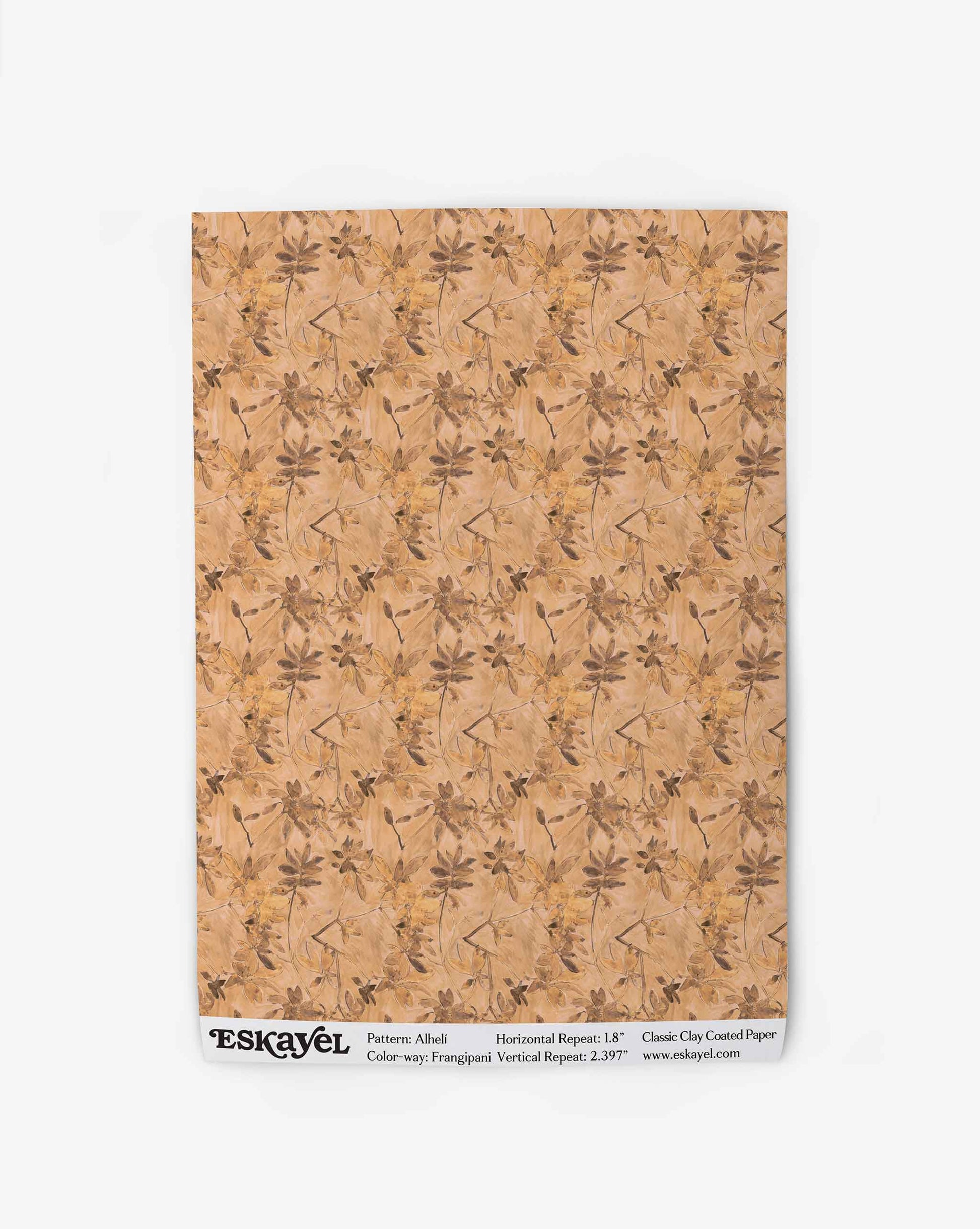 A swatch of Eskayel’s Alhelí wallpaper, a tiny repeating pattern inspired by tropical living, in the beige-based colorway Frangipani.
