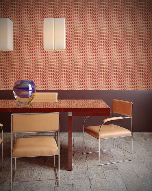 An interior using Eskayel’s Alhelí wallpaper, a tiny repeating pattern inspired by tropical living, in the orange-based colorway Golden Hour.