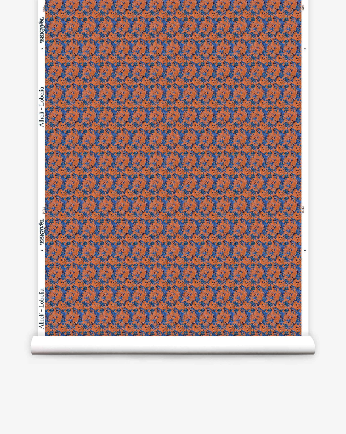 A roll of Eskayel’s Alhelí wallpaper, a tiny repeating pattern inspired by tropical living in the red-based Lobelia colorway.