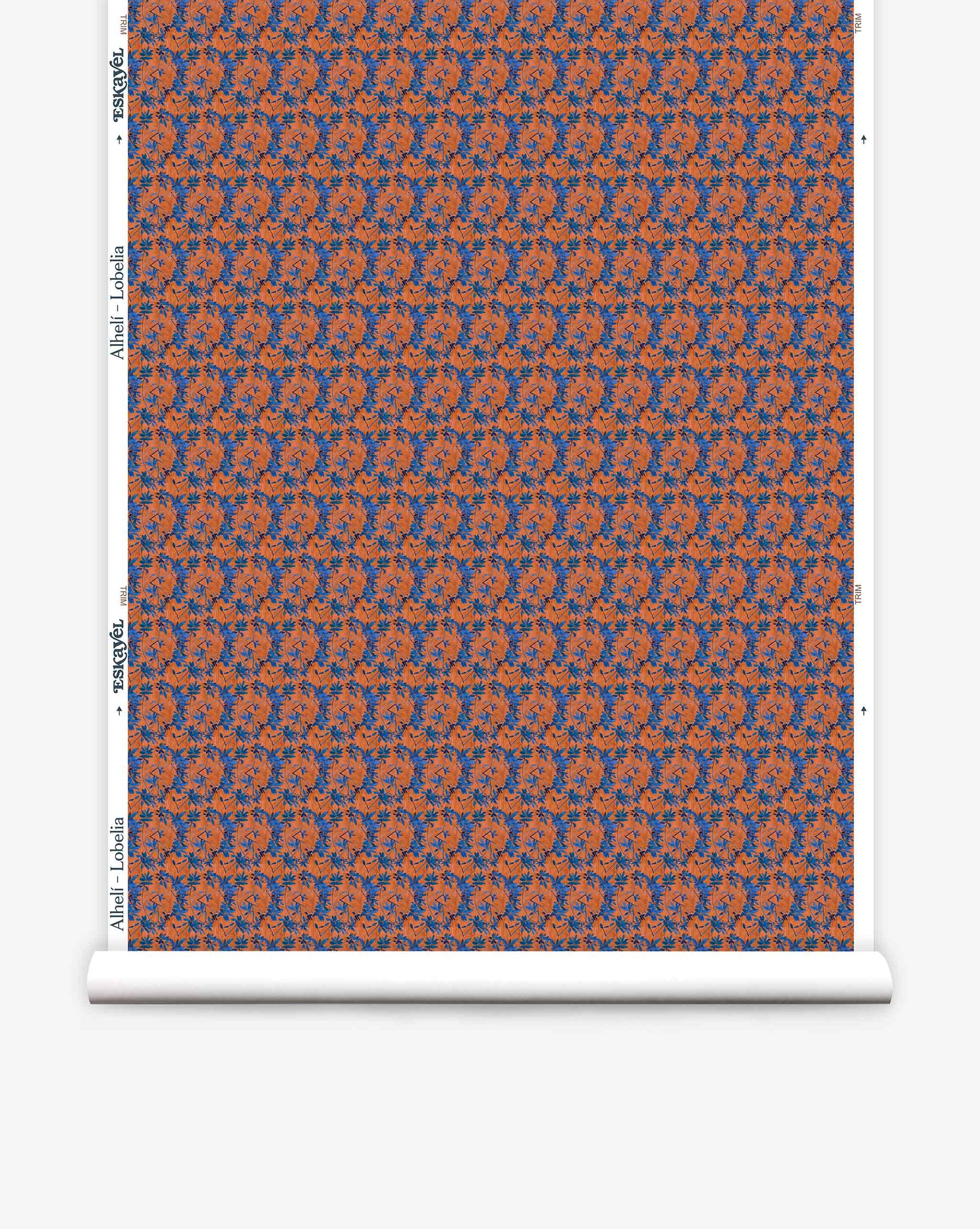 A roll of Eskayel’s Alhelí wallpaper, a tiny repeating pattern inspired by tropical living in the red-based Lobelia colorway.