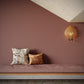 Alhelí Wallpaper Rubra — watercolor design of a tiny repeating pattern of tree leaves contrasting against a background field of color in a brown-based palette | Eskayel