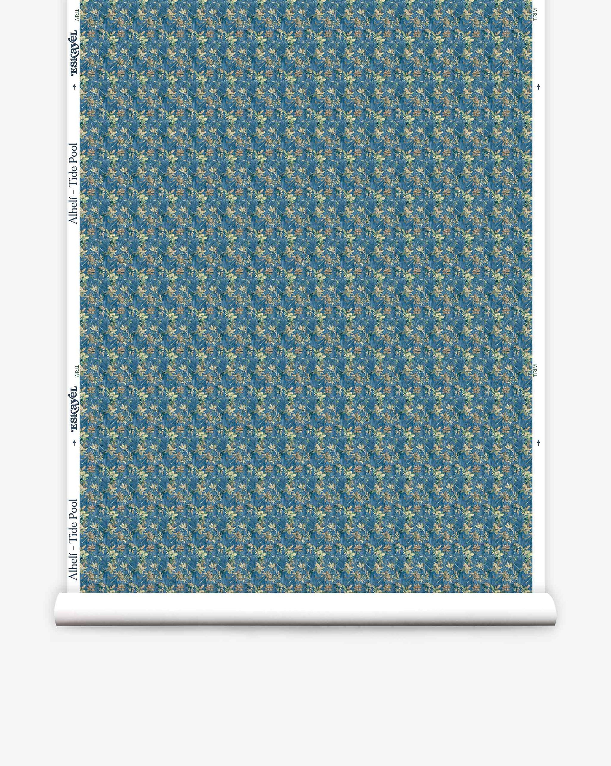 A roll of Eskayel’s Alhelí wallpaper, a tiny repeat pattern inspired by tropical light, shown in the blue-based Tide Pool colorway.