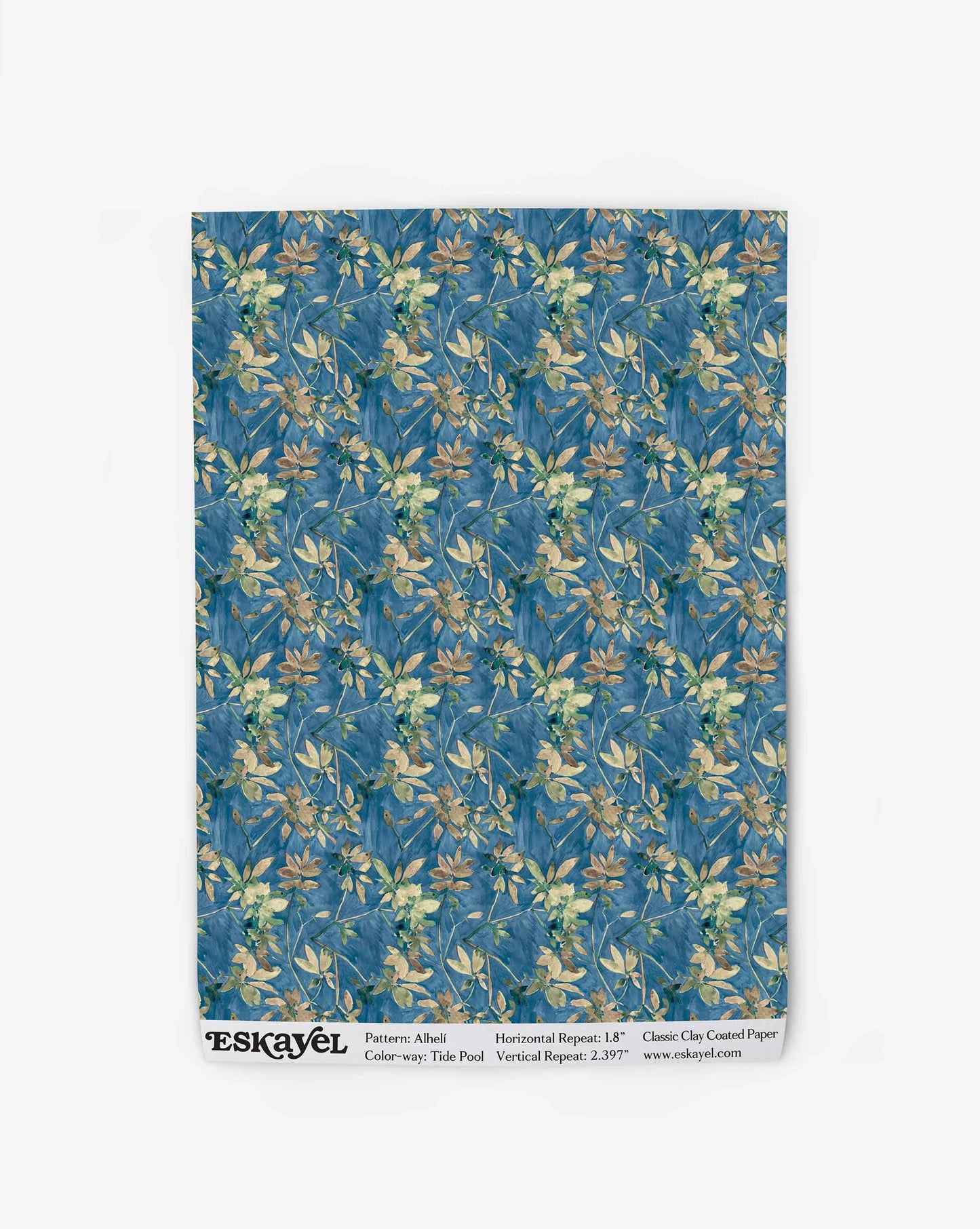 A swatch of Eskayel’s Alhelí wallpaper, a tiny repeat pattern inspired by tropical light, shown in the blue-based Tide Pool colorway.