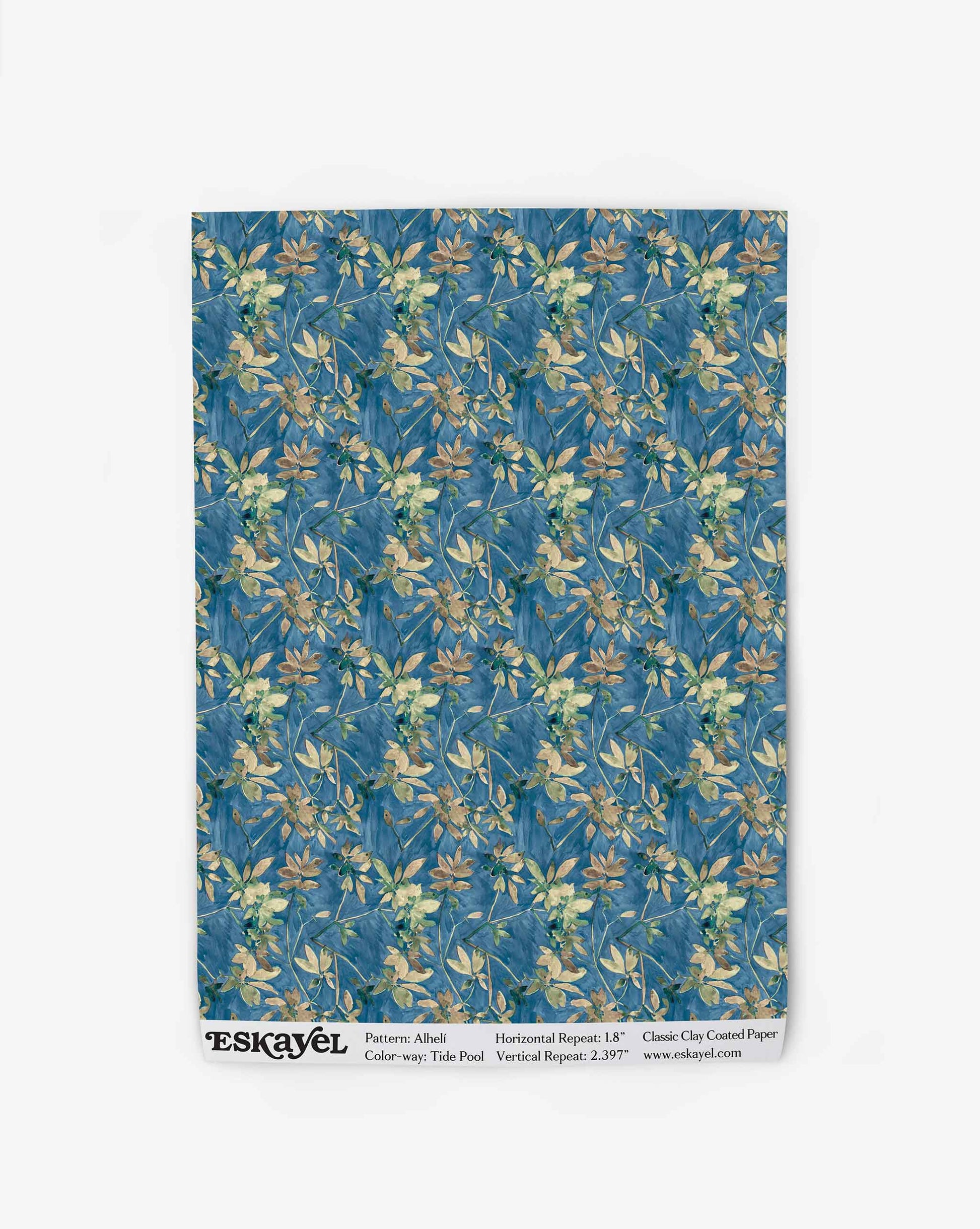 A swatch of Eskayel’s Alhelí wallpaper, a tiny repeat pattern inspired by tropical light, shown in the blue-based Tide Pool colorway.