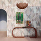 A room with a table and an Arcos Wallpaper Dusk on the wall suited for tropical climates