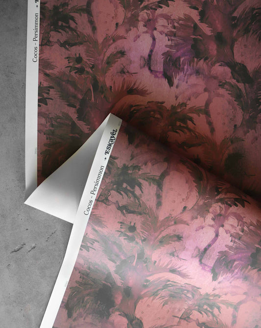 Wallpaper roll detail image of abstract Cocos Persimmon which features a palette of deep shades of pink, red, and magenta | Eskayel