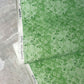 Green floral micro-printed wallpaper in the Crochet lace pattern in the colorway arugula.