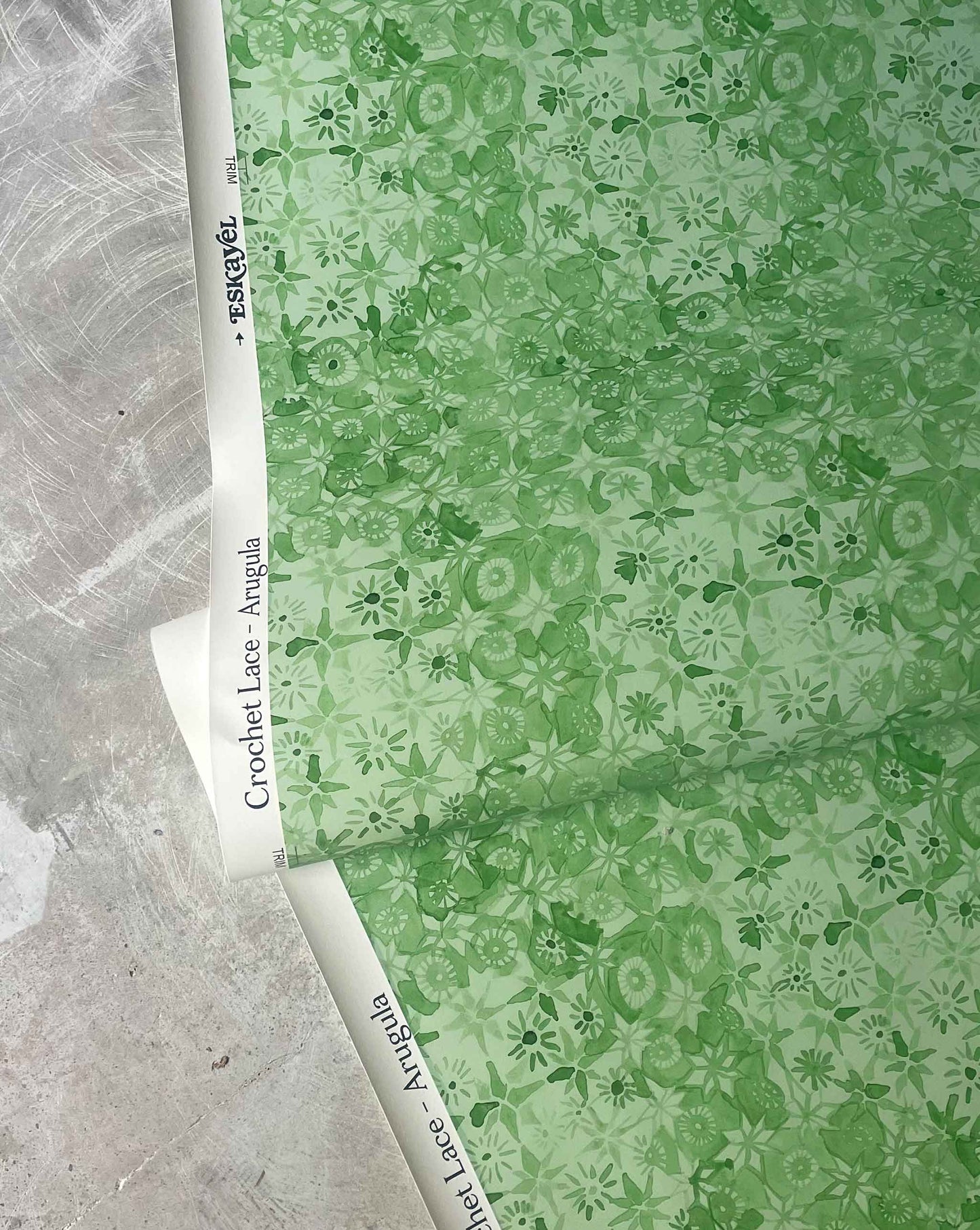 Green floral micro-printed wallpaper in the Crochet lace pattern in the colorway arugula.