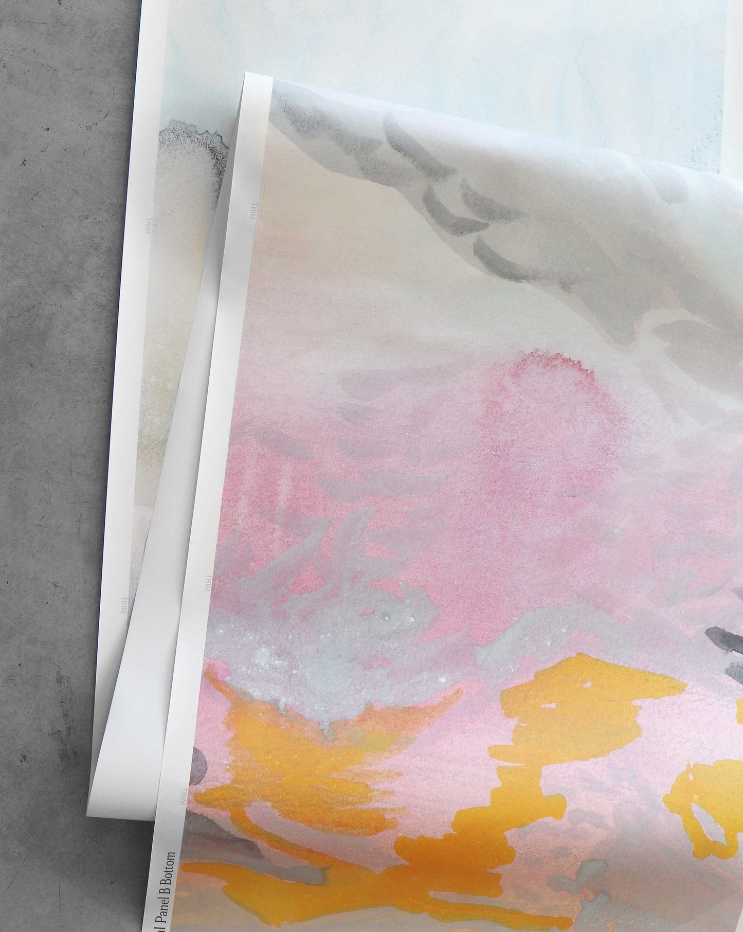 The Empyrean Wallpaper Mural in Dawn features a watercolor collage of abstract designs in pink, yellow, and gray, evoking Maldivian sunrises.