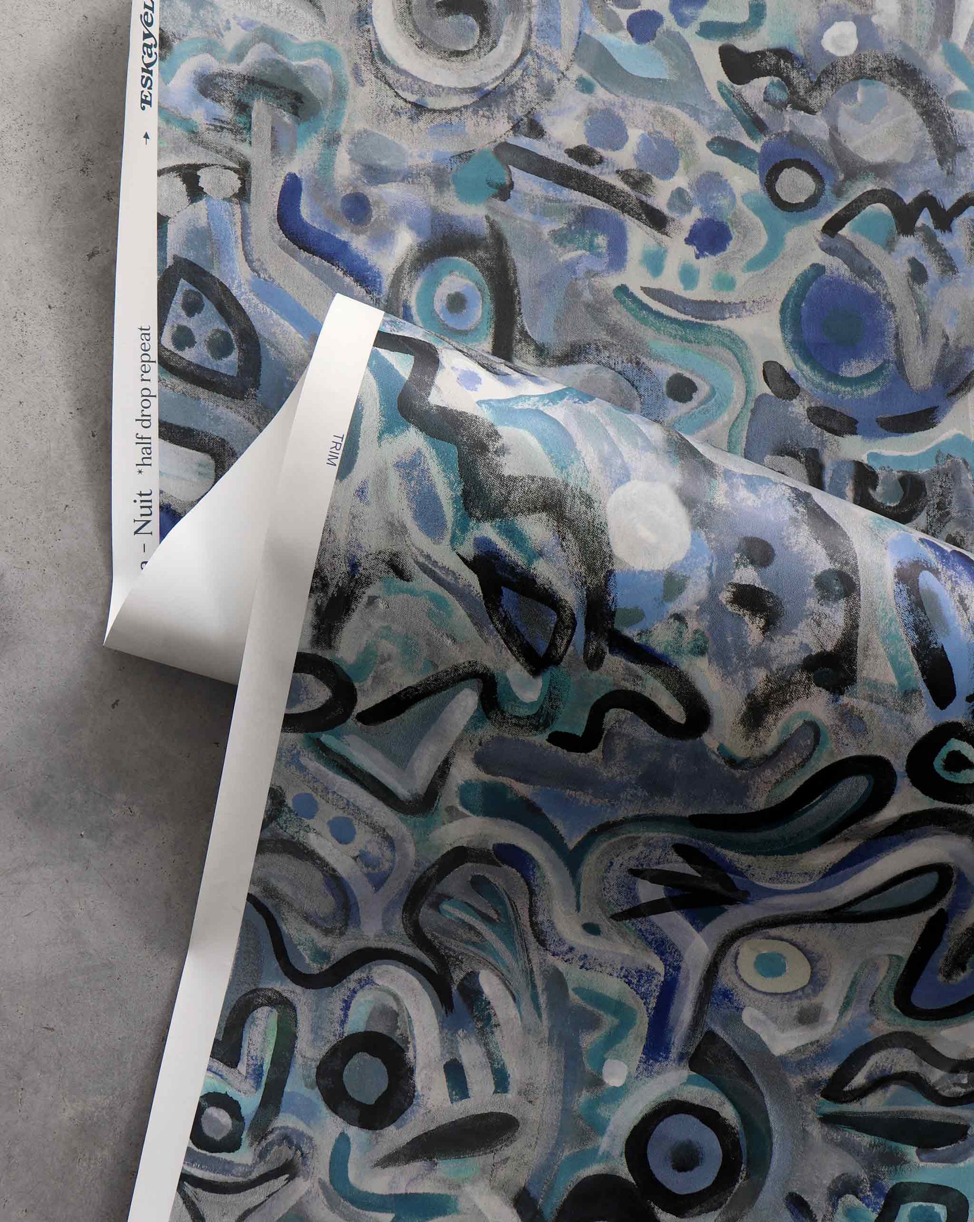 An image of Floripa Nuit Wallpaper with blue tones and a pattern inspired by the beautiful tropical island of Florianopolis in Brazil.