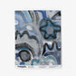 A swatch image of Floripa's wallpaper in the colorway Nuit with tones of blue.