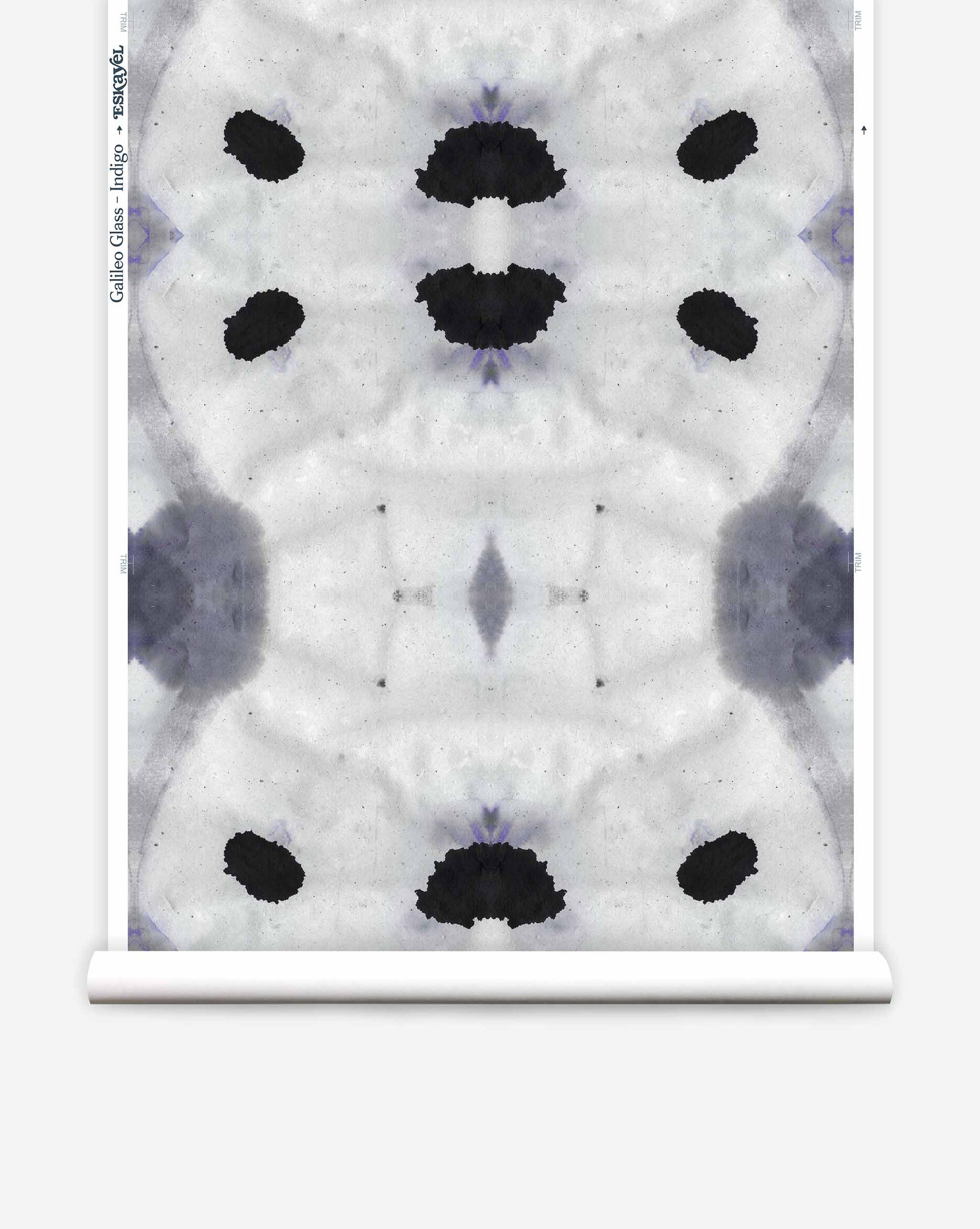 An inkblot test pattern with symmetrical dark shapes in an Indigo colorway on a white background.