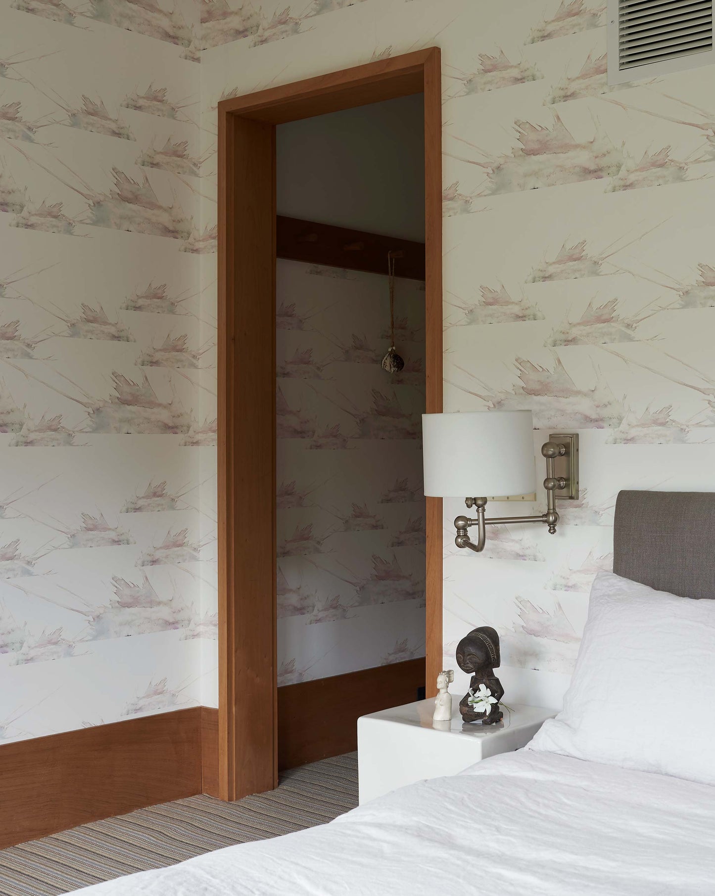 Eskayel's Love in the Middle Wallpaper in the colorway Ice installed in a bedroom.