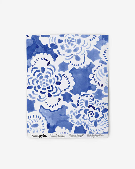 A swatch of Eskayel’s Margherita in Fresco Blue shows the medium-sized repeat wallpaper in a palette of blue shades.