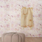 A room with high-end Melting Checks Wallpaper Terracotta color options and a pink ottoman