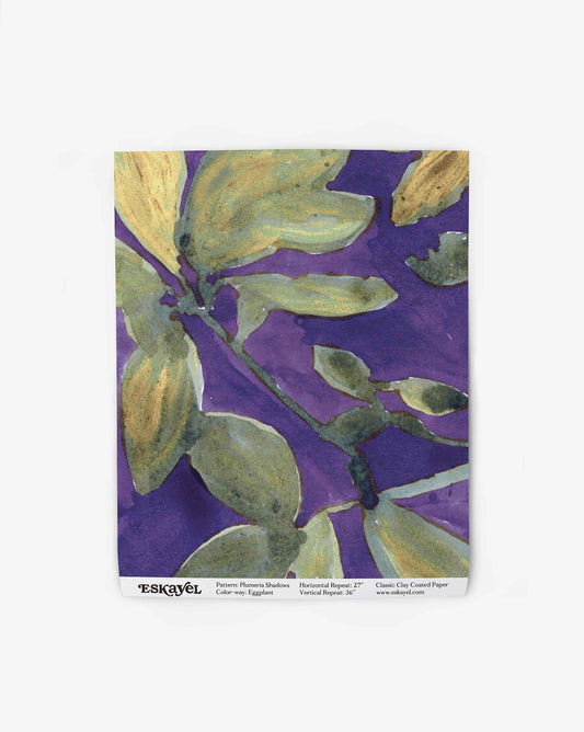 A wallpaper swatch image of Plumeria Shadows pattern in Eggplant, a colorway featuring a deep purple background and yellow-green leaves | Eskayel
