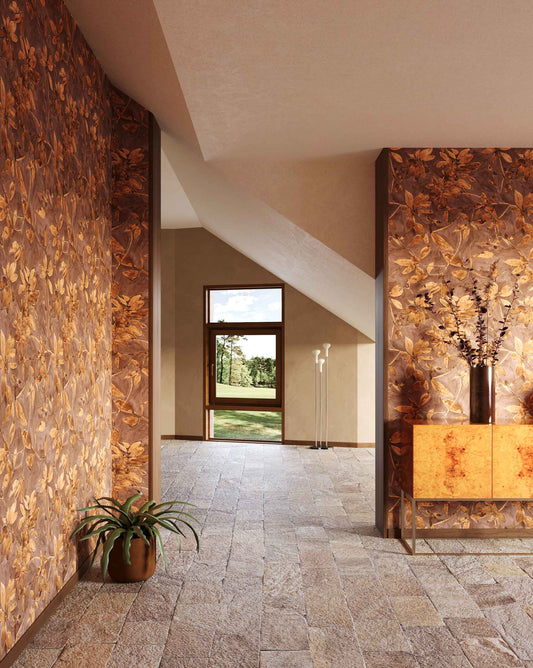 A room appointed with Eskayel’s Plumeria Shadows wallpaper pattern in Golden Hour, a colorway of rich brown and gold tones.