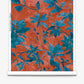 A wallpaper roll image of Plumeria Shadows Hibiscus, a colorway featuring rich red and deep blue tones of tropical branches and leaves casting sharp shadows in the midday sun | Eskayel