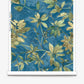 A roll of Eskayel’s Plumeria Shadows wallpaper pattern in Tide Pool, a colorway featuring a deep blue background.
