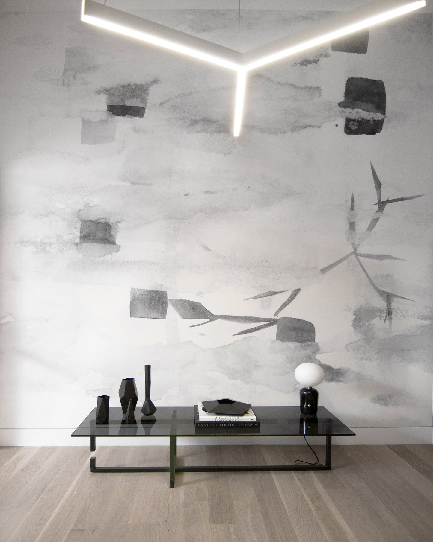 Eskayel's Sedge Wallpaper Mural with an abstract design and neutral palette is showcased in an open space..