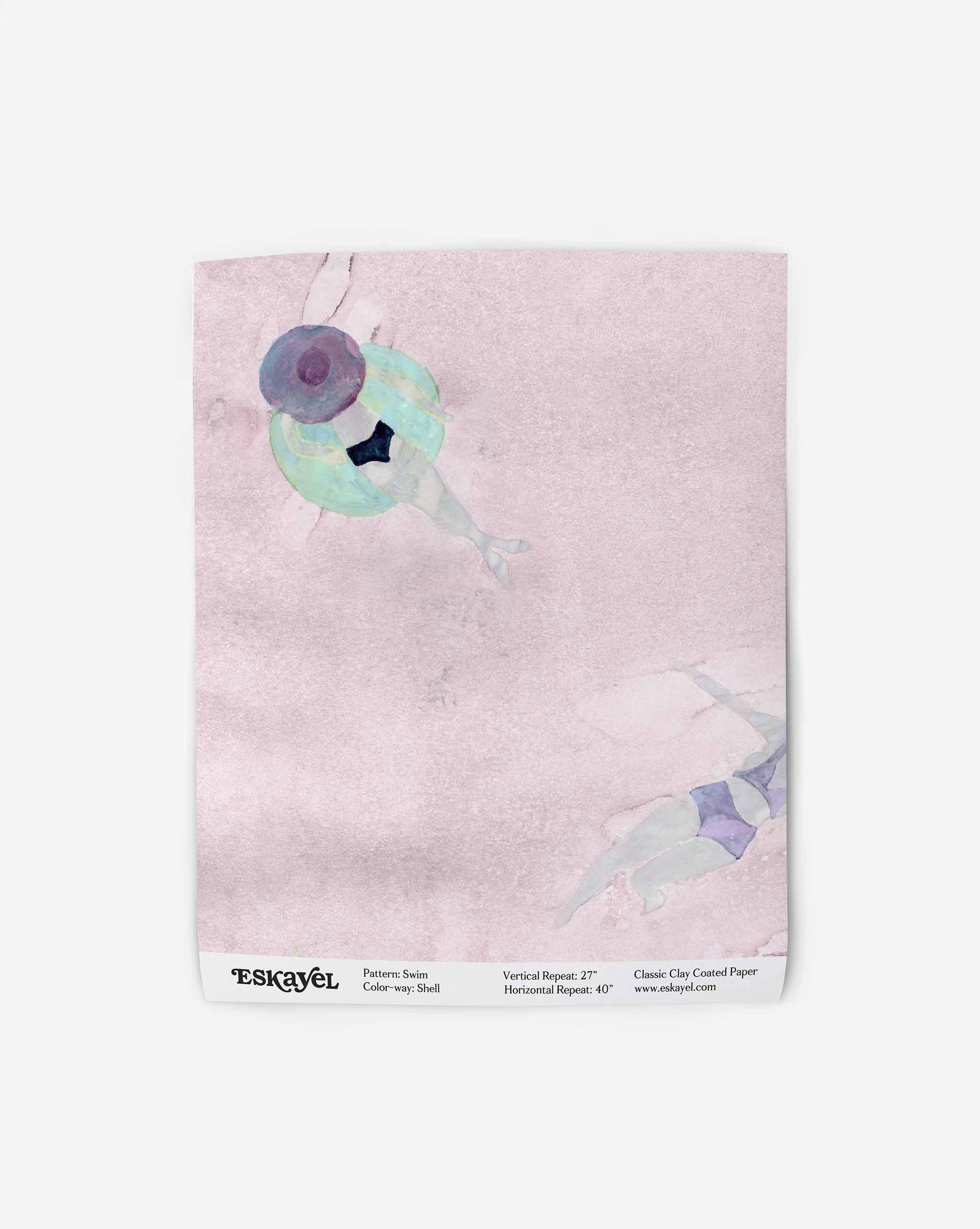 Two abstract figures swim in blue-green attire on a pinkish background, resembling watercolor art. Text at the bottom includes "ESKAYEL" and details about the pattern and paper. The Swim Wallpaper Sample||Shell is available upon order.