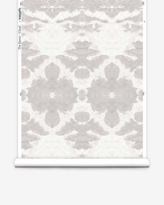 A roll of luxury wallpaper from The Dance Wallpaper||Cloud featuring a symmetrical, floral pattern in muted gray and white tones.