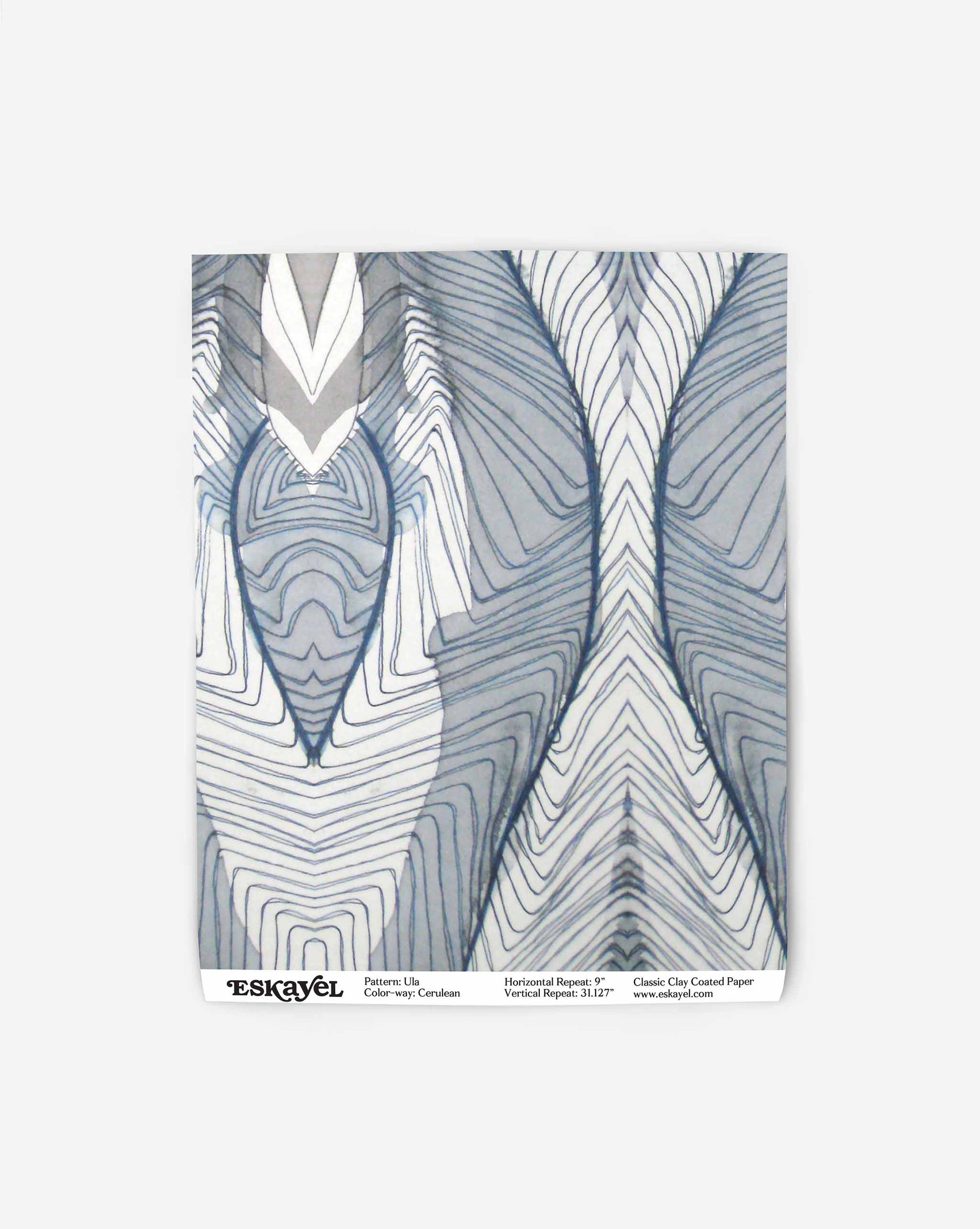A blue and white abstract design on a swatch of wallpaper