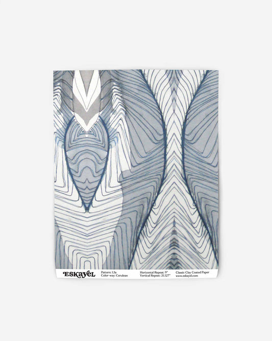 A blue and white abstract design on a swatch of wallpaper