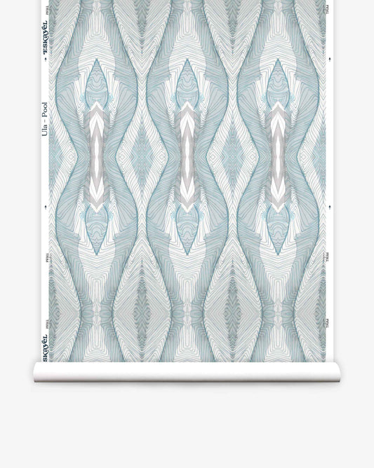 A roll of Ula Wallpaper||Pool featuring a symmetrical teal and white geometric pattern.