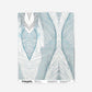 A blue and white wallpaper swatch with an abstract design