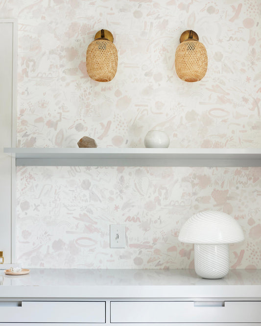 A white kitchen with Vol de Nuit Wallpaper Light Peach fabric