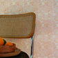 aya wallpaper in Grapefruit installed in a room — beach-themed graphic botanical wallpaper in pale peach with highlights of light yellow | Eskayel