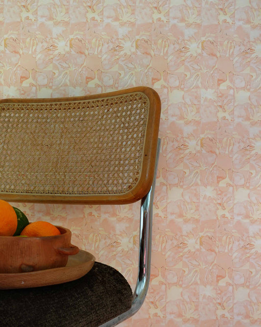 aya wallpaper in Grapefruit installed in a room — beach-themed graphic botanical wallpaper in pale peach with highlights of light yellow | Eskayel