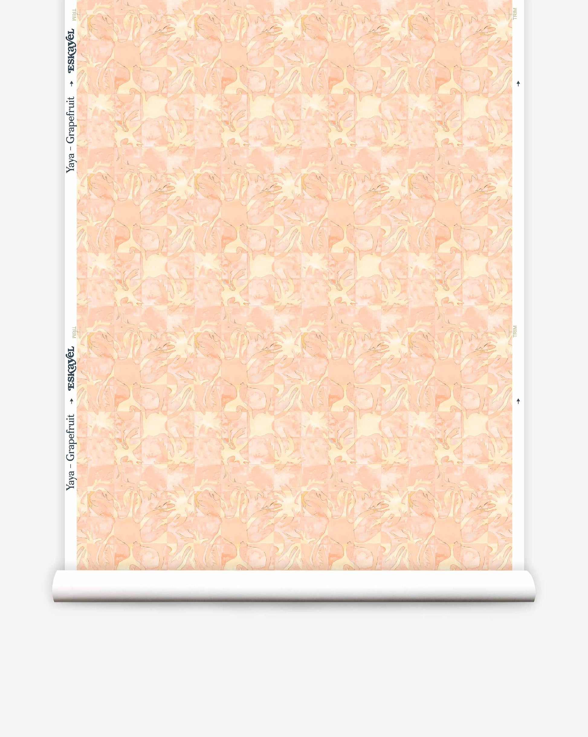 Yaya wallpaper in Grapefruit on a roll — beach-themed graphic botanical fabric in pale peach with highlights of light yellow | Eskayel