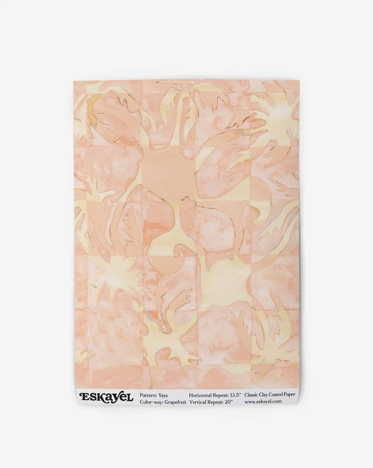 Yaya wallpaper in Grapefruit as a swatch — beach-themed graphic botanical wallpaper in pale peach with highlights of light yellow | Eskayel