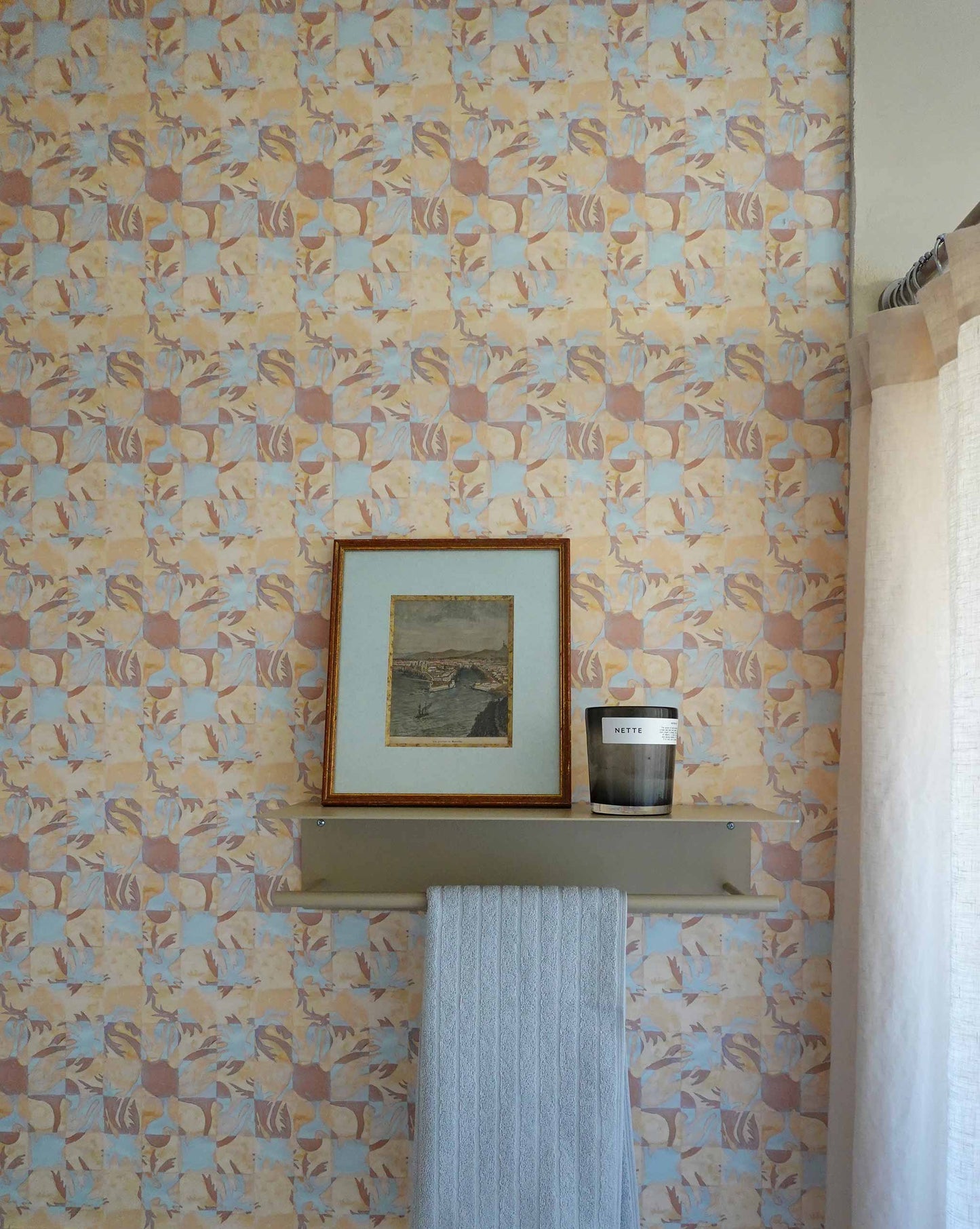 Yaya wallpaper in Husk installed in a room — beach-themed graphic botanical wallpaper in creamy yellow, earthy brown, and light blue | Eskayel