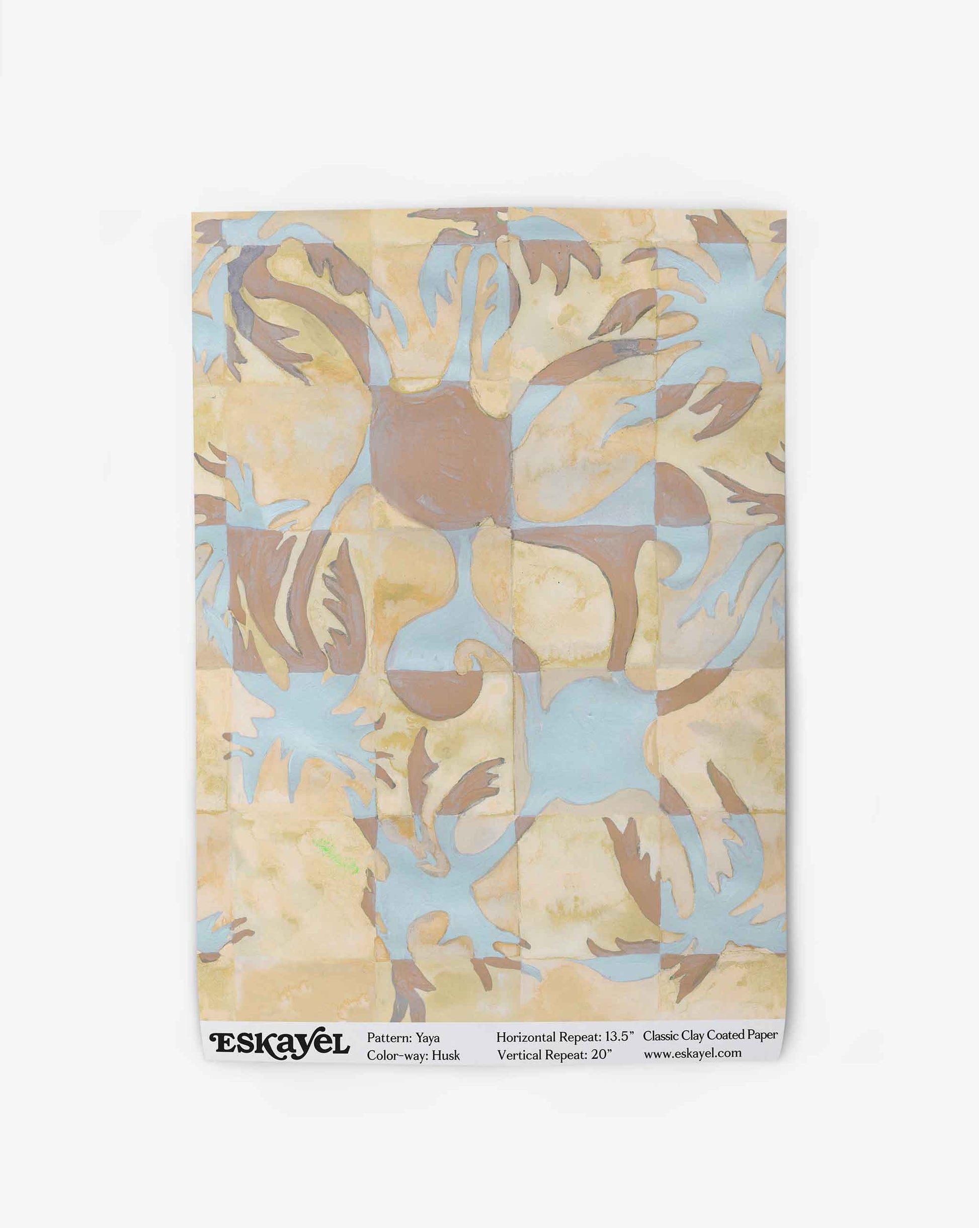 Yaya wallpaper in Husk as a swatch — beach-themed graphic botanical wallpaper in creamy yellow, earthy brown, and light blue | Eskayel