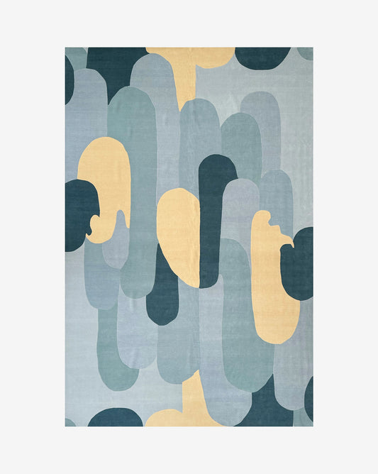 Eskayel's Arcos Sage handknotted rug is an abstract piece with geometric arch like shapes in blue, yellow, and green | Eskayel