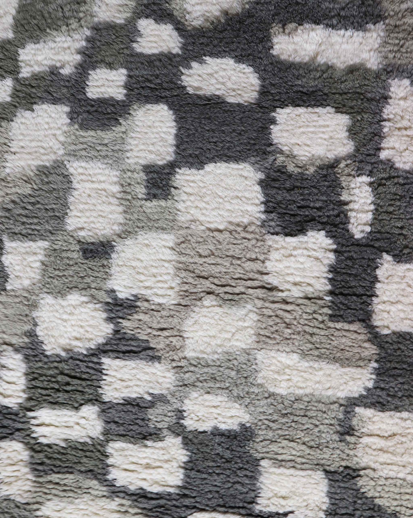A close up of a grey and white Chess Hand Knotted Rug