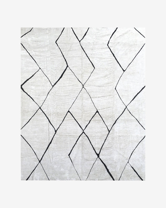 A dynamic black and white hand knotted rug with Large Peaks design.