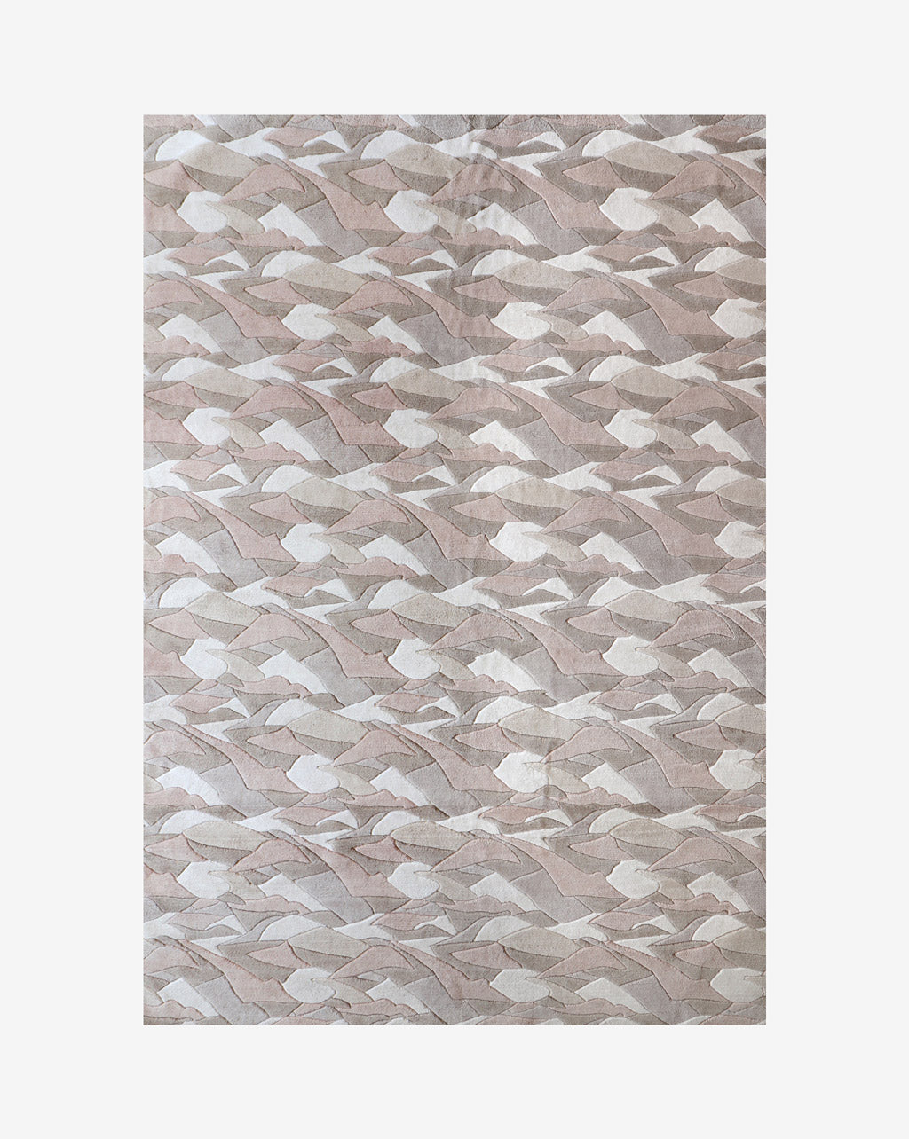  The Mani merino wool rug in Air features a neutral palette that includes white, beige, tan, and dusty pink.